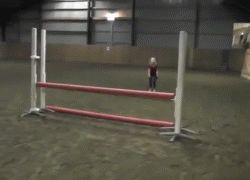 10 years girl jumps hurdles on four legs