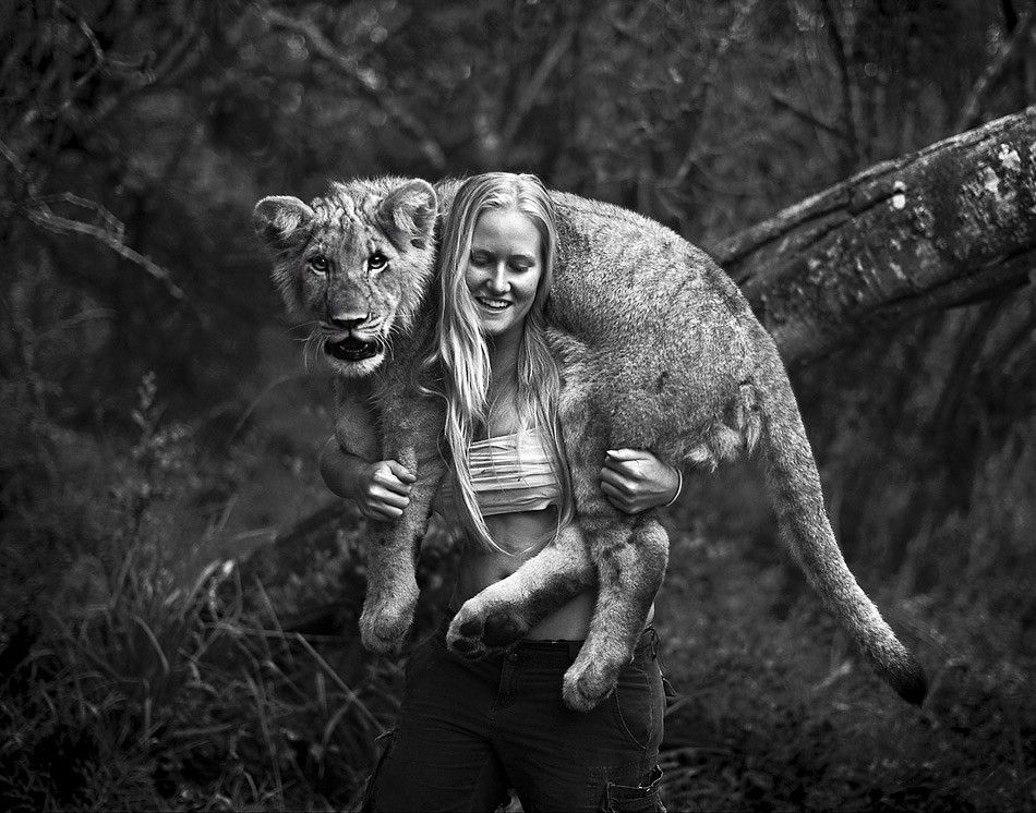 A-girl-with-a-young-lion.jpg