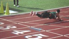 Track Runner Falls, Turn Fail Into Worm Dance