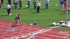 Runner carries fallen competitor to the finish line