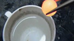 Red hot nickel ball in water