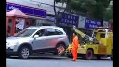 Shanghai Lady Drives Off With Tow Truck