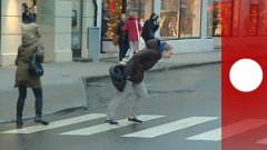 People Walking Against Powerful Wind