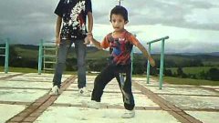 Older And Younger Kids Dance Together