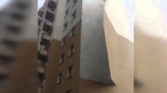 Strong winds rip facade
