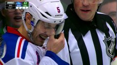 Puck gets wedged in defenceman's mask