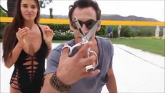 Man redesigns a bathing suit off of the model by cutting her up!